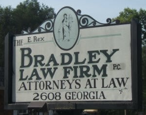 Photo of a sign outside the firm's office